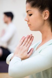 Woman sitting in Lotus position