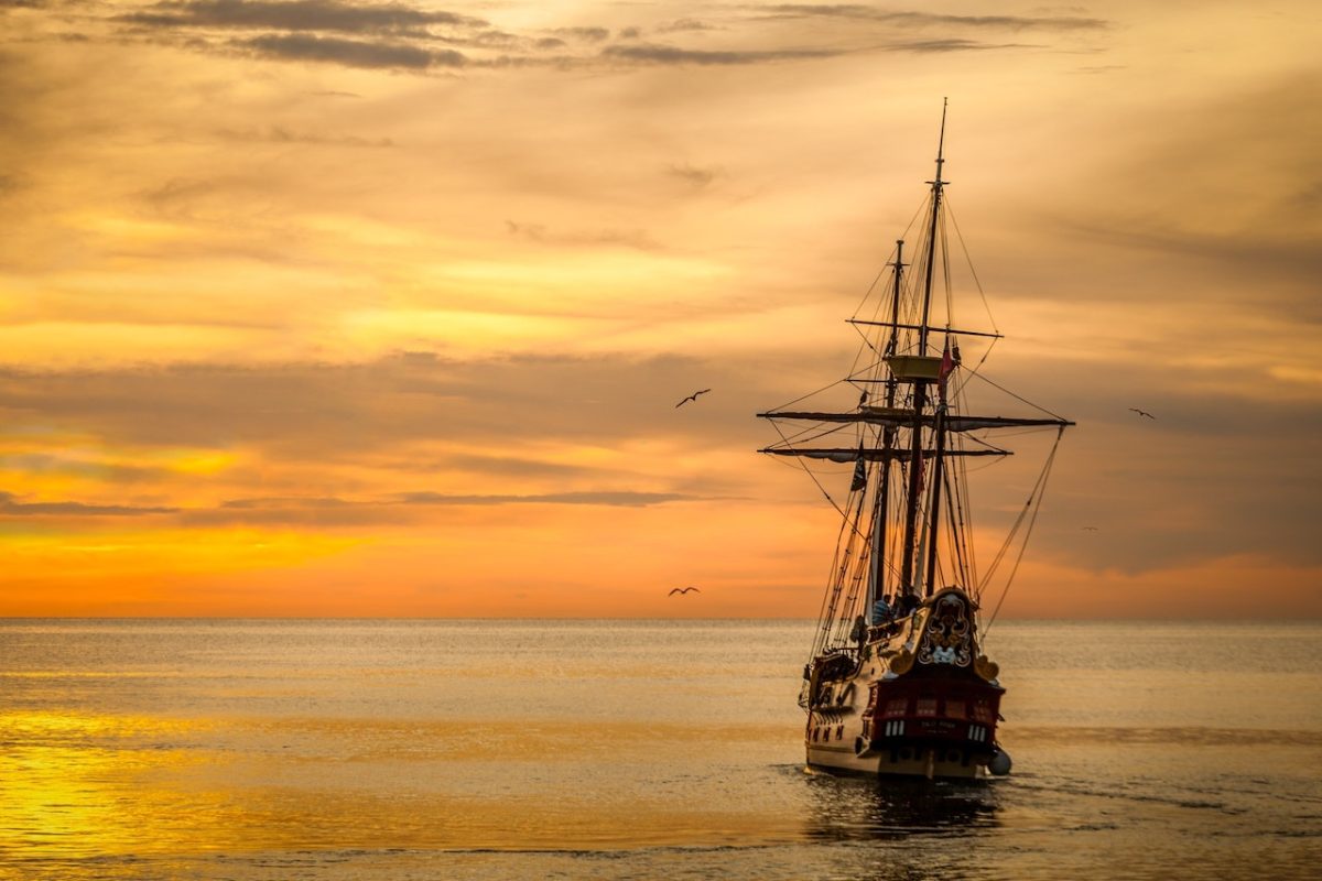 Photo by Pixabay: https://www.pexels.com/photo/a-pirate-ship-sailing-on-sea-during-golden-hour-37730/