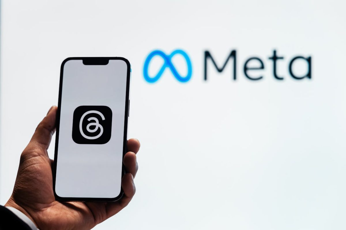 Meta logo and smartphone with Threads logo (Source: Pexels)