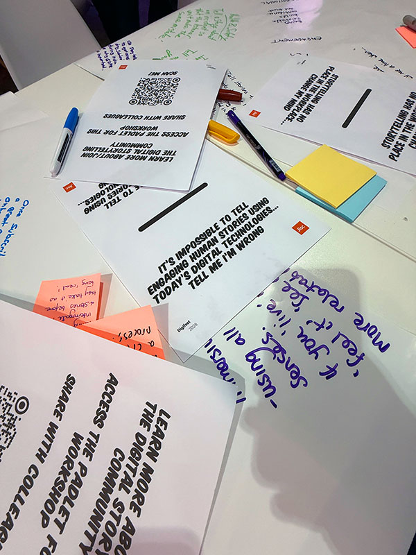 sticky notes and flip chart paper with comments from the workshop